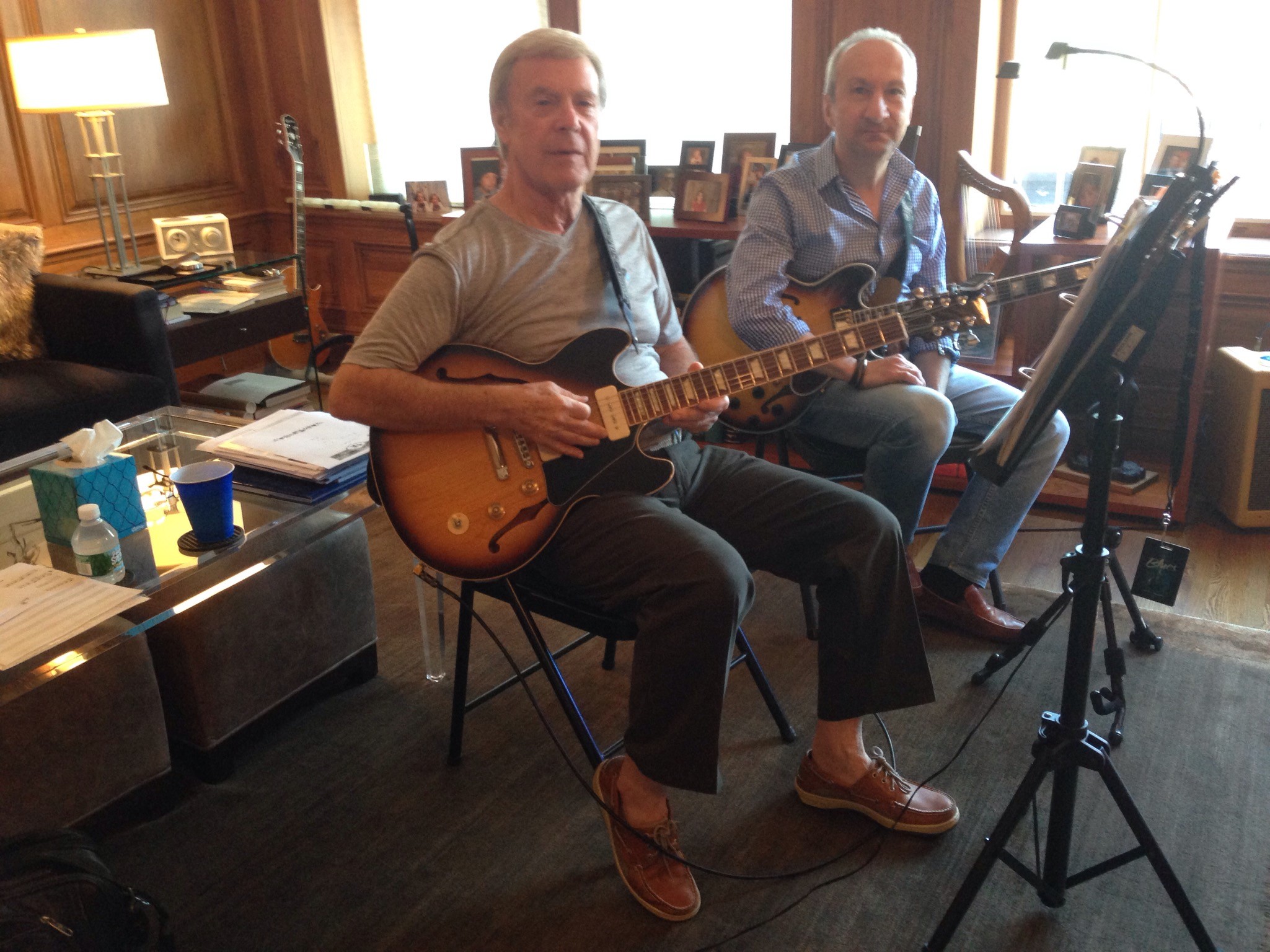 Two Elderly Men Playing Guitar