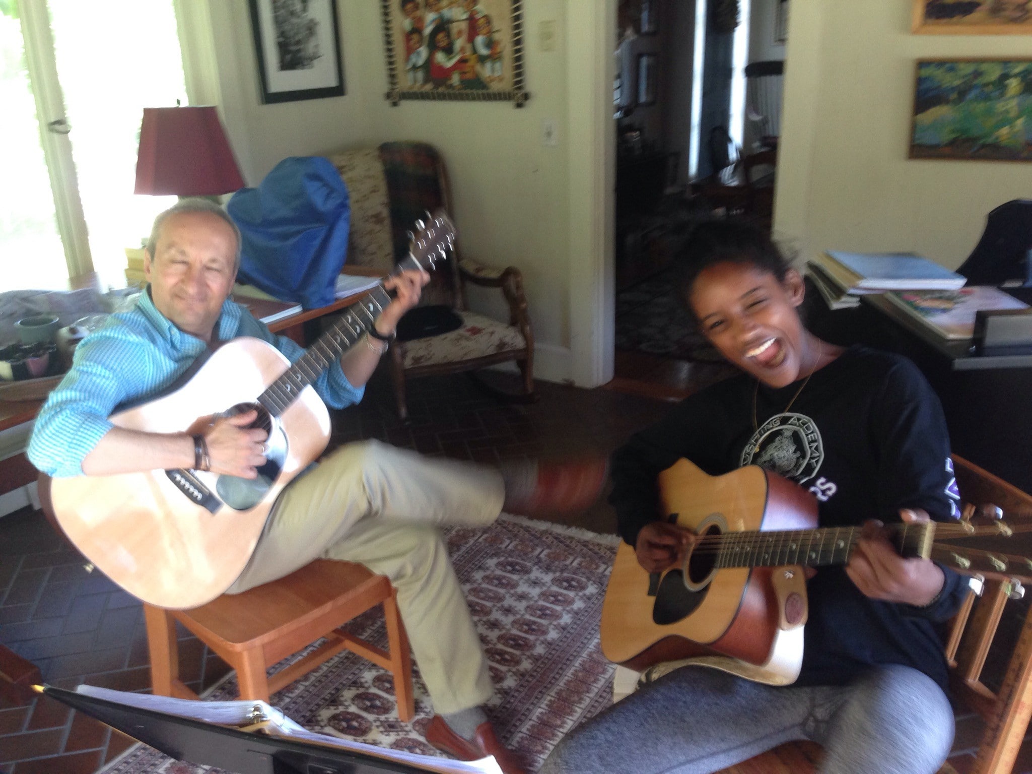 A Lady With Luigi Happily Playing The Guitar